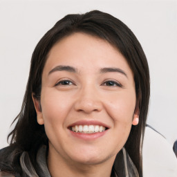 Joyful white young-adult female with long  black hair and brown eyes