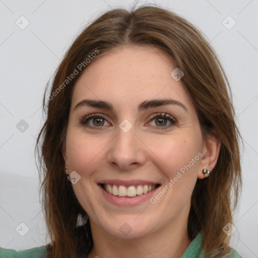 Joyful white young-adult female with long  brown hair and green eyes