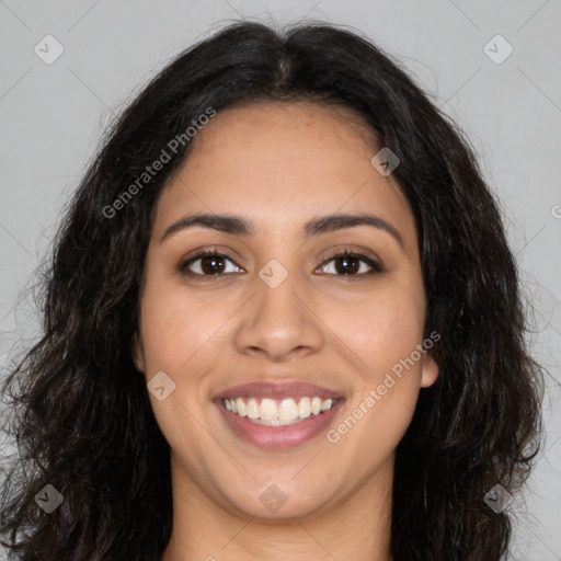 Joyful latino young-adult female with long  brown hair and brown eyes