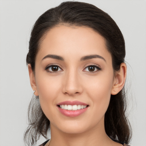 Joyful white young-adult female with medium  brown hair and brown eyes