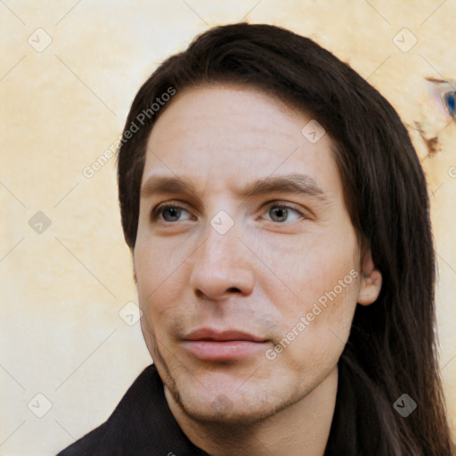 Neutral white young-adult male with long  brown hair and brown eyes