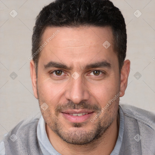 Joyful white adult male with short  brown hair and brown eyes