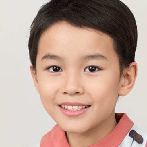 Joyful white child female with short  brown hair and brown eyes