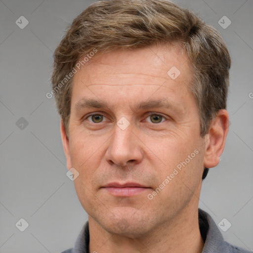 Joyful white adult male with short  brown hair and grey eyes