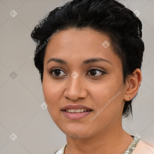 Joyful latino young-adult female with short  black hair and brown eyes