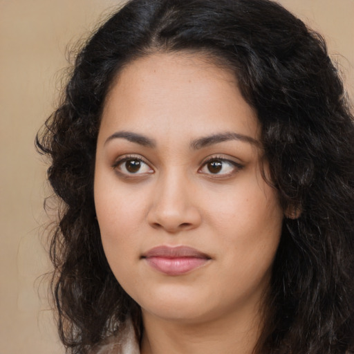 Neutral latino young-adult female with long  brown hair and brown eyes