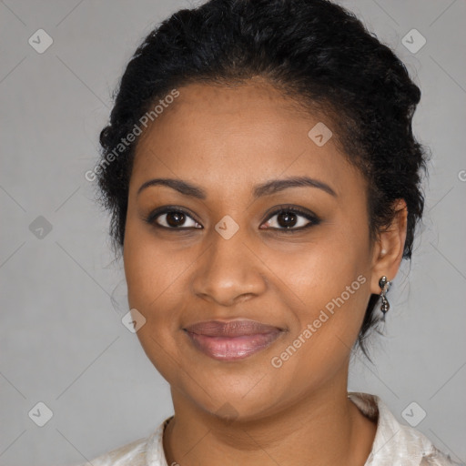 Joyful black young-adult female with medium  black hair and brown eyes