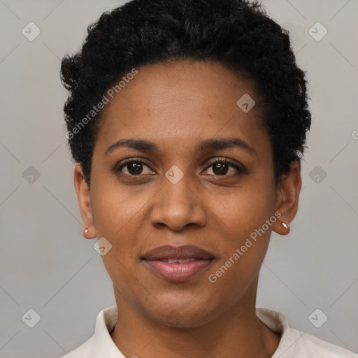 Joyful black young-adult female with short  black hair and brown eyes