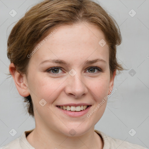 Joyful white young-adult female with medium  brown hair and blue eyes