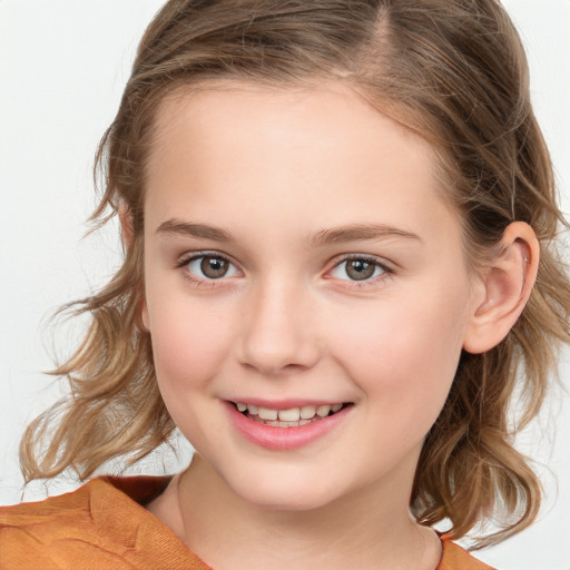 Joyful white child female with medium  brown hair and brown eyes