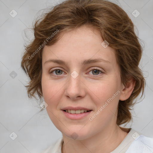 Joyful white young-adult female with medium  brown hair and green eyes