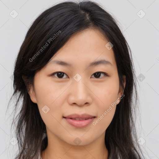 Joyful asian young-adult female with long  brown hair and brown eyes