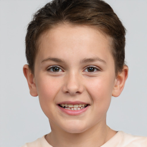 Joyful white child female with short  brown hair and brown eyes