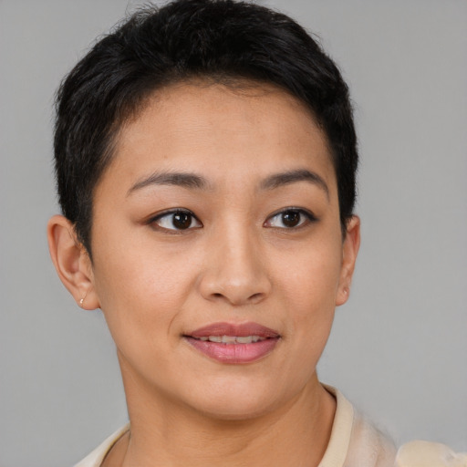 Joyful latino young-adult female with short  brown hair and brown eyes