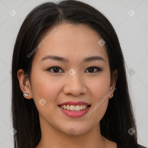 Joyful asian young-adult female with long  brown hair and brown eyes