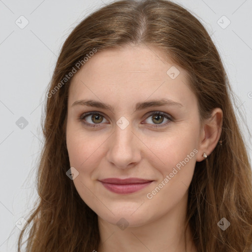 Joyful white young-adult female with long  brown hair and green eyes