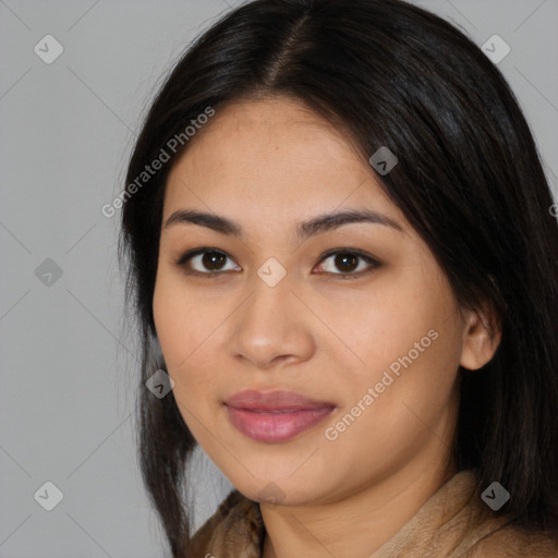 Joyful latino young-adult female with long  brown hair and brown eyes