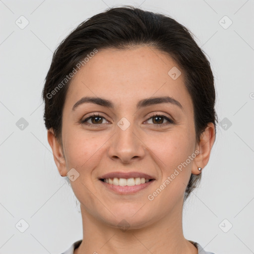 Joyful white young-adult female with medium  brown hair and brown eyes