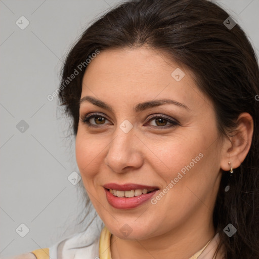 Joyful white adult female with medium  brown hair and brown eyes