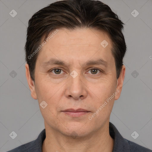 Joyful white adult male with short  brown hair and brown eyes