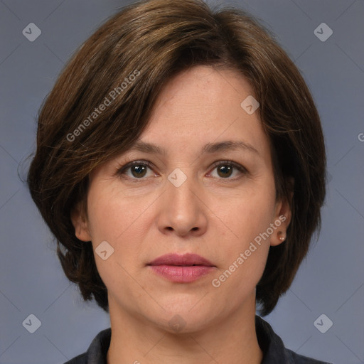 Joyful white adult female with medium  brown hair and grey eyes