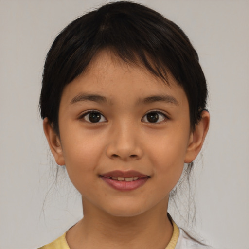 Joyful asian child female with medium  brown hair and brown eyes