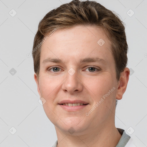 Joyful white young-adult female with short  brown hair and grey eyes