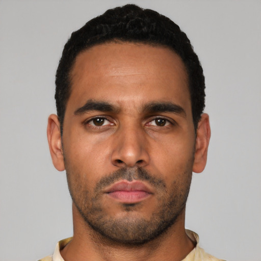 Neutral latino young-adult male with short  black hair and brown eyes