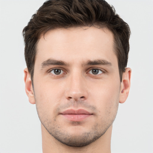 Neutral white young-adult male with short  brown hair and brown eyes