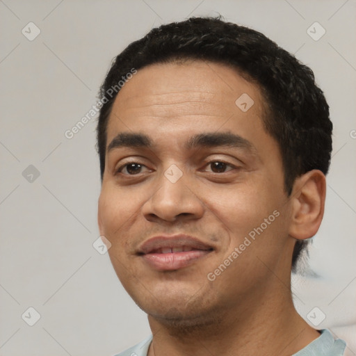 Joyful latino young-adult male with short  black hair and brown eyes