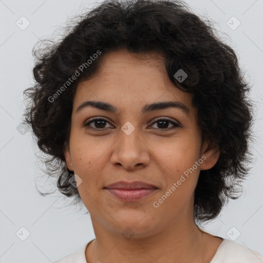 Joyful black young-adult female with medium  brown hair and brown eyes