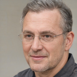 Joyful white middle-aged male with short  brown hair and brown eyes