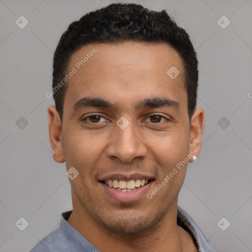 Joyful latino young-adult male with short  black hair and brown eyes