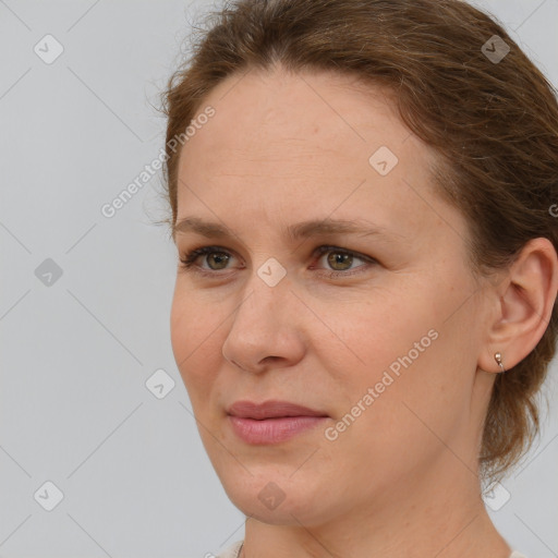 Joyful white adult female with medium  brown hair and grey eyes