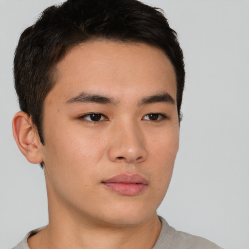 Neutral asian young-adult male with short  brown hair and brown eyes