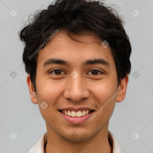 Joyful latino young-adult male with short  brown hair and brown eyes