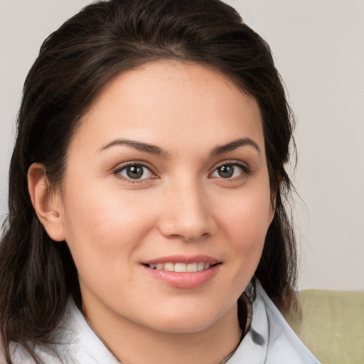 Joyful white young-adult female with medium  brown hair and brown eyes