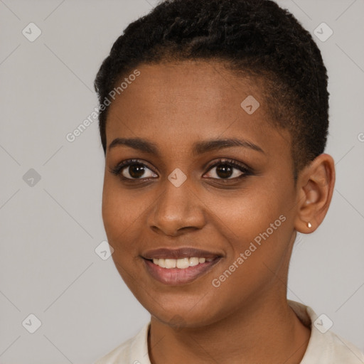 Joyful black young-adult female with short  black hair and brown eyes