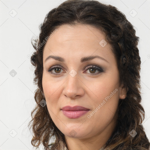 Joyful white adult female with long  brown hair and brown eyes