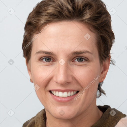 Joyful white young-adult female with short  brown hair and grey eyes