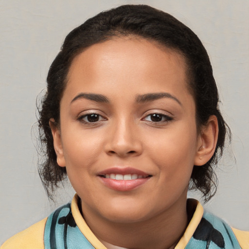 Joyful latino young-adult female with medium  brown hair and brown eyes