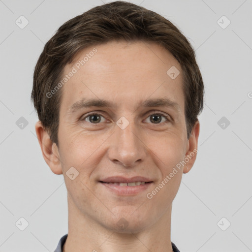 Joyful white adult male with short  brown hair and grey eyes