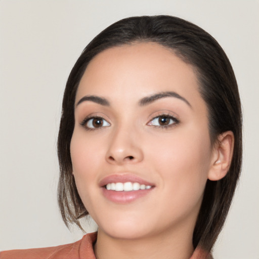 Joyful white young-adult female with medium  black hair and brown eyes