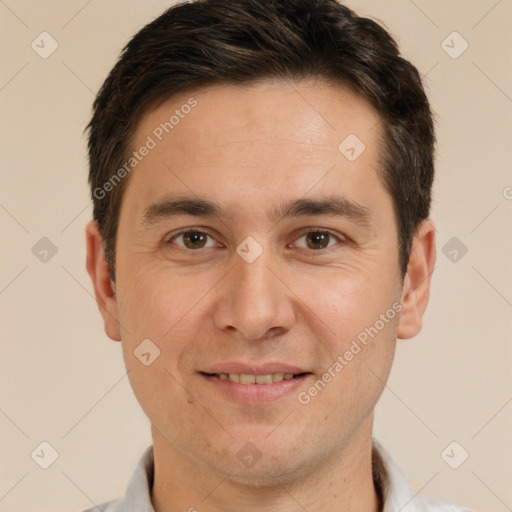 Joyful white adult male with short  brown hair and brown eyes