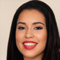 Joyful white young-adult female with long  black hair and brown eyes