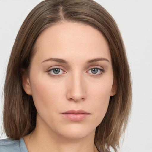 Neutral white young-adult female with medium  brown hair and grey eyes