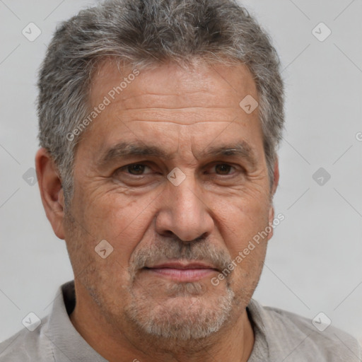 Neutral white middle-aged male with short  gray hair and brown eyes