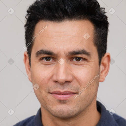 Joyful white young-adult male with short  black hair and brown eyes