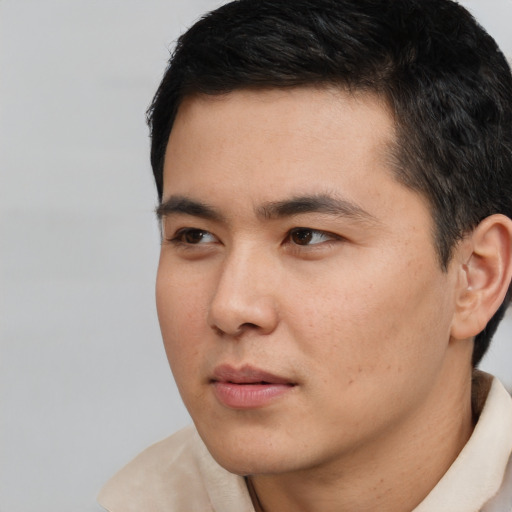 Neutral white young-adult male with short  black hair and brown eyes