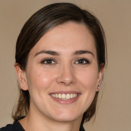 Joyful white young-adult female with medium  brown hair and brown eyes